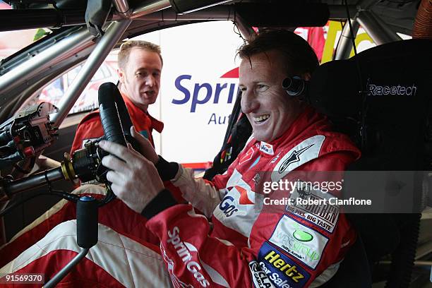 Mark Skaife, driver of the Sprint Gas Raing Team, talks with co-driver Greg Murphy prior to practice for the Bathurst 1000, which is round 10 of the...