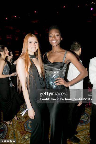 Models Oluwatoniloba Dreher-Adenuga and Klaudia Anna Giez attend the 2018 amfAR Gala New York at Cipriani Wall Street on February 7, 2018 in New York...