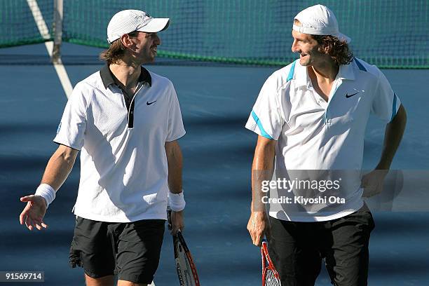 Christopher Kas of Germany talks with his partner Jaroslav Levinsky of the Czech Republic in their doubles match against Marco Chiudinelli of...