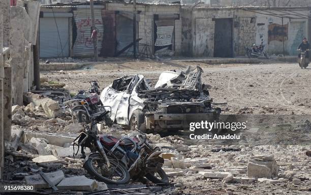 Wreckages of motorcycles and a car are seen after Russian airstrikes hit Mishmishan village of Idlib's Jisr al-Shughur district in Syria on February...