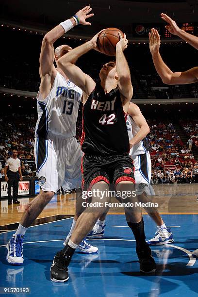 Miami Heat forward Shavlik Randolph pump fakes Orlando Magic center Marcin Gortat during the pre-season game on October 7, 2008 at Amway Arena in...