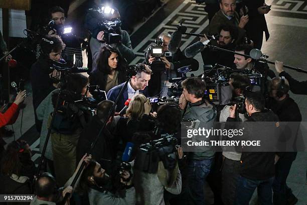 Belgian lawyer representing the civilian party and police officers Tom Bauwens makes his way through the media reporters as he leave the "Palais de...