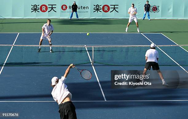 Jaroslav Levinsky of the Czech Republic serves with his partner Christopher Kas of Germany in their doubles match against Marco Chiudinelli of...