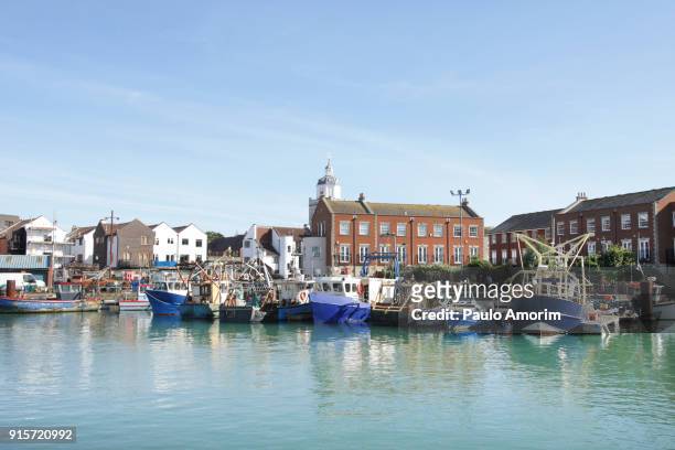 fishing boats at old port in portsmouth,england - portsmouth england stock pictures, royalty-free photos & images