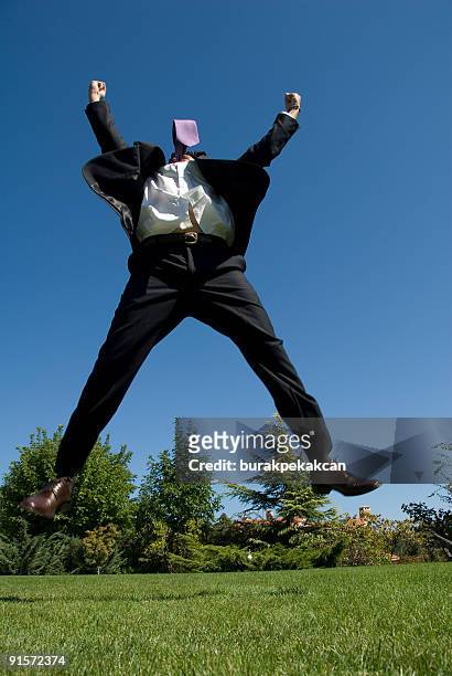 businessman jumping in air raising arms, zekeriyak&#246;y, istanbul, turkey - many hands in air stock pictures, royalty-free photos & images