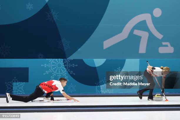 Kaitlyn Lawes of Canada sweeps the ice against the United States of America in the Curling Mixed Doubles Round Robin Session 2 during the PyeongChang...