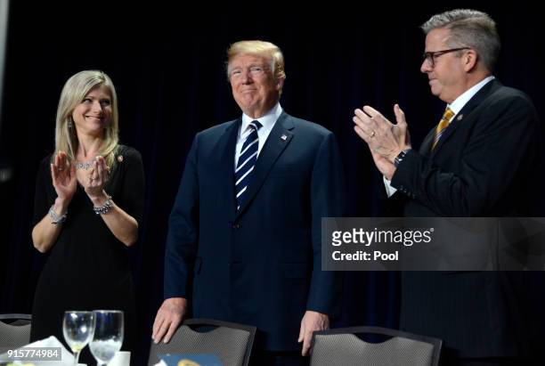 Rep. Randy Hultgren and his wife Christy clap for President Donald Trump at the National Prayer Breakfast on February 8, 2018 in Washington, DC....