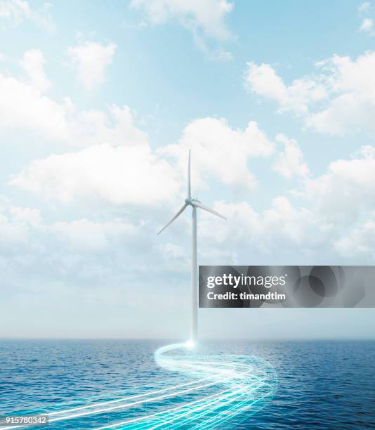 light trails coming from a wind turbine in the sea - wind turbine long exposure stock-fotos und bilder