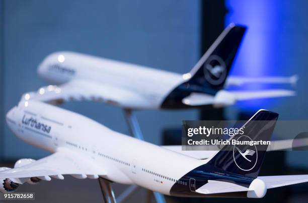 Lufthansa Group event to present the new blue livery on an Lufthansa Jumbo 747-8 at Frankfurt Airport. Tailfins of airplan models with Lufthansa logo...