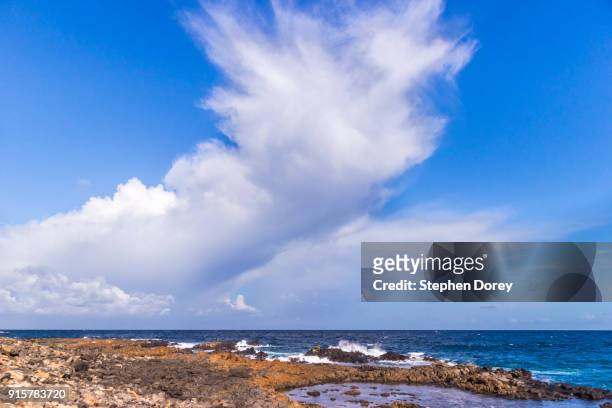 a cloud formation over the atlantic ocean on the canary island of fuerteventura. - caleta de fuste stock pictures, royalty-free photos & images