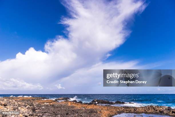 a cloud formation over the atlantic ocean on the canary island of fuerteventura. - caleta de fuste stock pictures, royalty-free photos & images