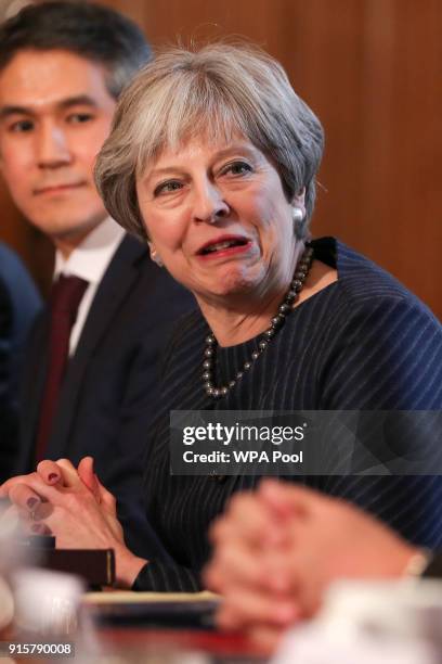 Britain's Prime Minister Theresa May speaks as she hosts a roundtable with Japanese investors in the UK at 10 Downing Street on February 8, 2018 in...