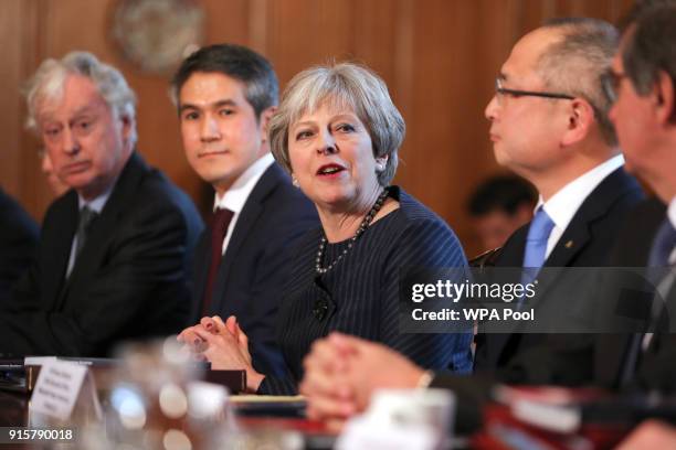 Britain's Prime Minister Theresa May speaks as she hosts a roundtable with Japanese investors in the UK at 10 Downing Street on February 8, 2018 in...