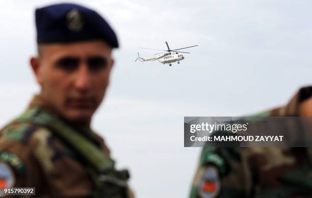 Picture taken on February 8 shows a UN peacekeeping force in Lebanon helicopter flies over Lebanon's southern border town of Naqura, as an Israeli...