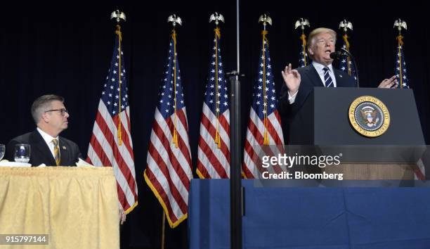President Donald Trump speaks while as Representative Randy Hultgren, a Republican for Illinois, left, listens during the National Prayer Breakfast...