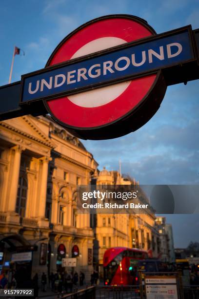 Winter sunshine on a London Underground sign and the Trocadero in Piccadilly Circus, on 6th February 2018, in London, England.