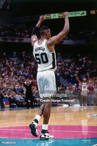 David Robinson of the San Antonio Spurs celebrates during Game Two of the First Round of the 1995 NBA Playoffs played on April 30, 1995 at the Alamo...