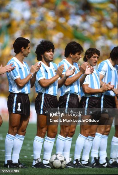July 1982 Barcelona : FIFA World Cup : Argentina v Brazil : Osvaldo Ardiles and Diego Maradona applaud the pre-match anthem .
