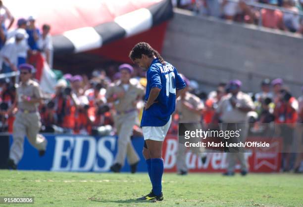 July 1994 Pasadena: FIFA World Cup Final - Brazil v Italy - Roberto Baggio of Italy hangs his head after missing the vital penalty during the...