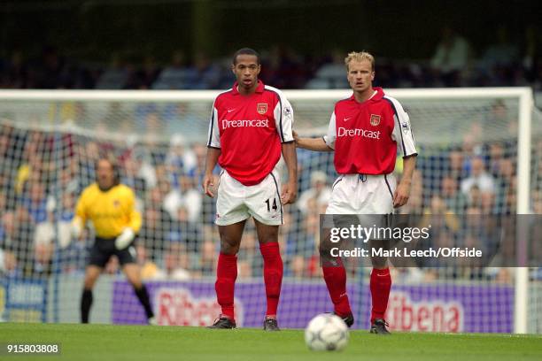 September 2001 London; FA Barclaycard Premiership - Chelsea v Arsenal - Dennis Bergkamp and Thierry Henry of Arsenal stand in a two man Arsenal...