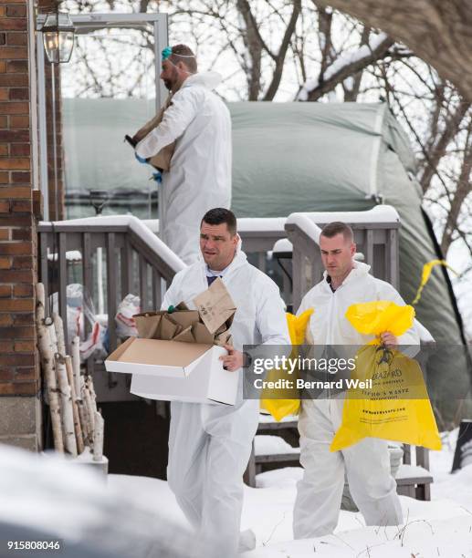 Forensic investiagtors remove evidence from home at 57 Mallory Cresc., Toronto. Planters containing body parts linked to accused serial killer Bruce...