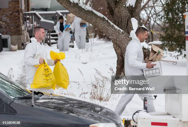 Forensic investigators remove evidence from inside the home at 53 Mallory Cresc., Toronto. Planters containing body parts linked to accused serial...