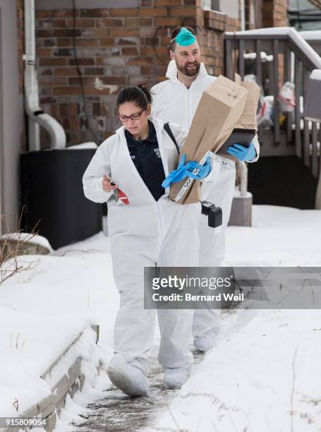 Forensic investigators remove evidence from inside the home at 53 Mallory Cresc., Toronto. Planters containing body parts linked to accused serial...