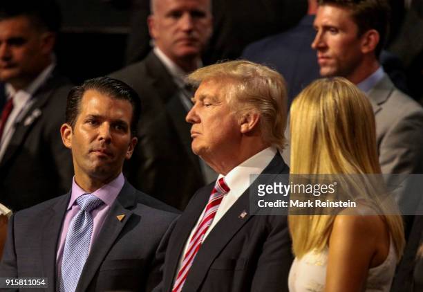 American real estate developer and presidential candidate Donald Trump stands with two of his children Donald Jr and Ivanka Trump as they attend the...