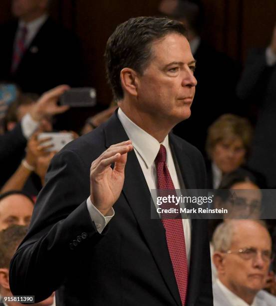 American lawyer and former FBI Director James Comey is sworn in before his testimony before the Senate Intelligence Committee, Washington DC, June 8,...
