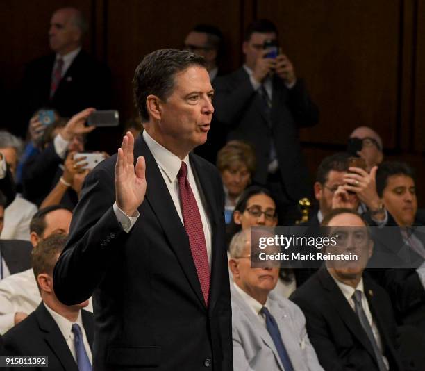 American lawyer and former FBI Director James Comey is sworn in before his testimony before the Senate Intelligence Committee, Washington DC, June 8,...