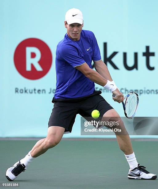 Tomas Berdych of the Czech Republic returns a shot in his match against Andreas Beck of Germany during day four of the Rakuten Open Tennis tournament...
