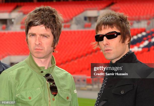 Noel Gallagher and Liam Gallagher of Oasis pose at Wembley Stadium on October 16, 2008 in London, England.