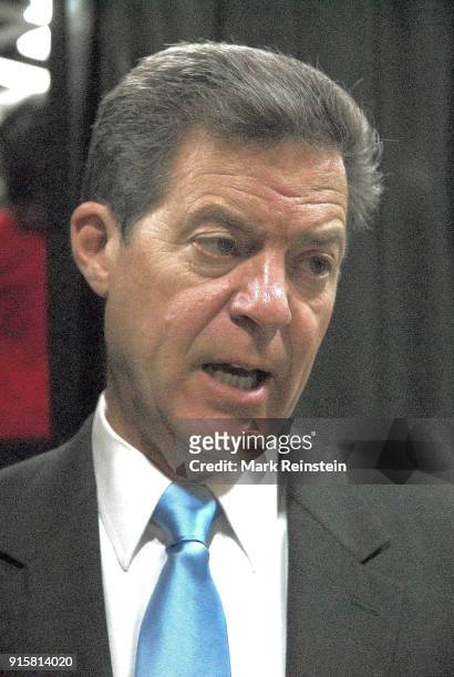 Close-up of American politician Kansas Governor Sam Brownback as he talks to the press at an election night party in the Capitol Plaza Hotel...