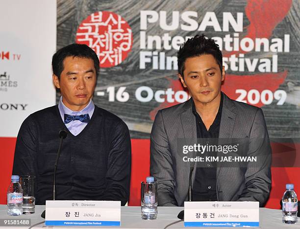 South Korean actor Jang Dong-Gun and director Jang Jin take part in a news conference for the opening film "Good Morning President" at the 14th Pusan...