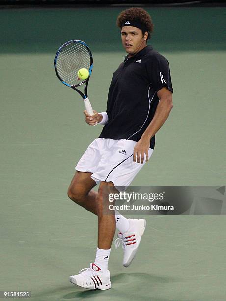 Jo-Wilfried Tsonga of France plays a forehand in his match against Richard Gasquet of France during day four of the Rakuten Open Tennis tournament at...