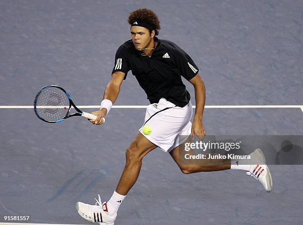 Jo-Wilfried Tsonga of France plays a forehand in his match against Richard Gasquet of France during day four of the Rakuten Open Tennis tournament at...