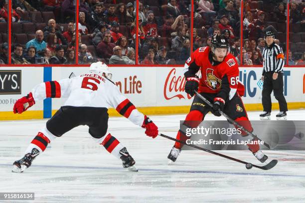 Mike Hoffman of the Ottawa Senators controls the puck against Andy Greene of the New Jersey Devils at Canadian Tire Centre on February 7, 2018 in...