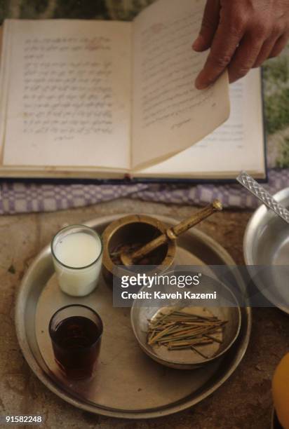 Zoroastrian Mobed Balivani reads from the Zoroastrian holy book, or Avesta at a religious ceremony marking Zarathustra's birthday, Sharifabad near...
