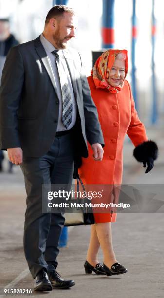 Queen Elizabeth II boards a train at King's Lynn Station to return to London after her Christmas break at Sandringham House on February 7, 2018 in...