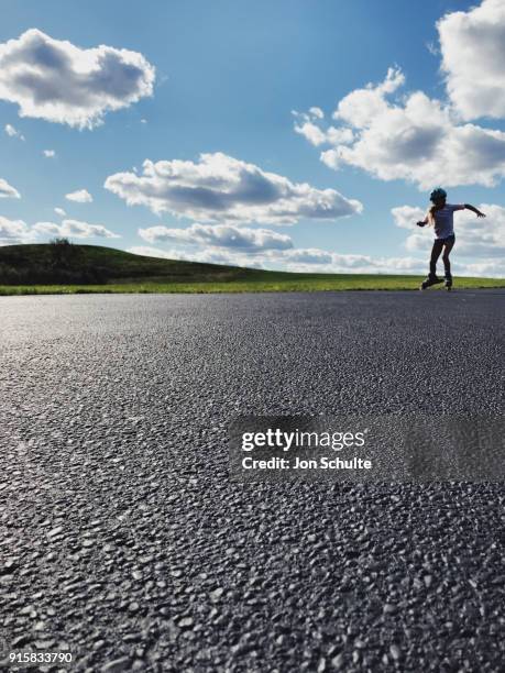 little girl inline skating at park - west chester, ohio stock pictures, royalty-free photos & images