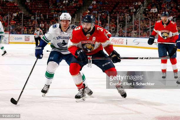 Keith Yandle of the Florida Panthers skates for position against Markus Granlund of the Vancouver Canucks at the BB&T Center on February 6, 2018 in...
