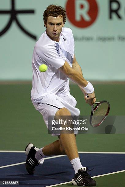 Ernests Gulbis of Latvia returns a shot in his match against Juan Monaco of Argentina during day four of the Rakuten Open Tennis tournament at Ariake...