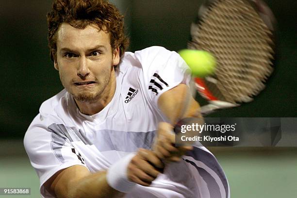 Ernests Gulbis of Latvia returns a shot in his match against Juan Monaco of Argentina during day four of the Rakuten Open Tennis tournament at Ariake...