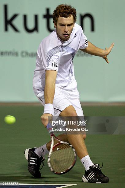 Ernests Gulbis of Latvia returns a shot in his match against Juan Monaco of Argentina during day four of the Rakuten Open Tennis tournament at Ariake...