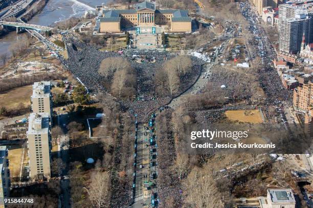 Fans crowd the streets to watch a Super Bowl victory parade for the Philadelphia Eagles NFL football team on February 8, 2018 in Philadelphia,...