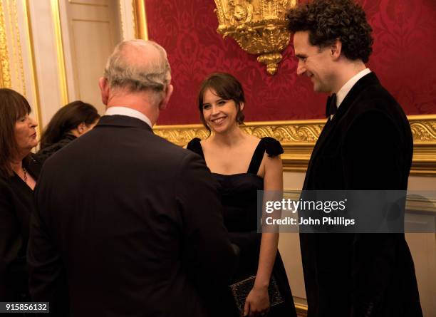 Prince Charles, Prince of Wales meets actress Felicity Jones as he attends the Prince’s Trust 'Invest in Futures' pre-dinner reception celebrating...