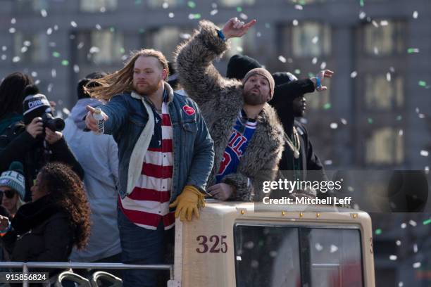 Beau Allen and Chris Long of the Philadelphia Eagles celebrate from the bus during the Super Bowl LII parade on February 8, 2018 in Philadelphia,...