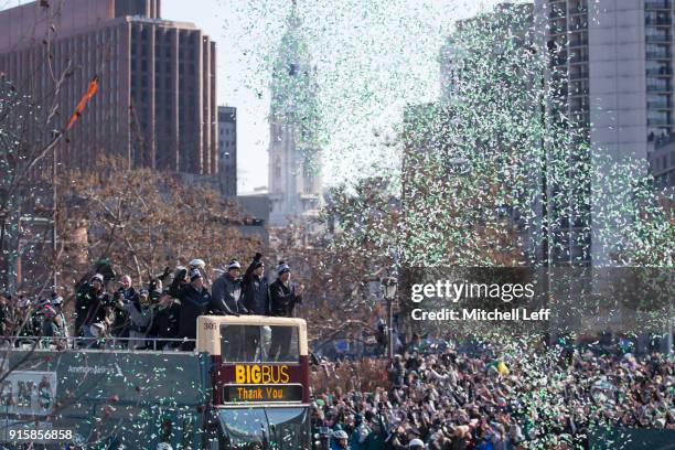 Philadelphia Eagles owner Jeffrey Lurie, Nick Foles, Nate Sudfeld, and Carson Wentz ride the bus during the Super Bowl LII parade on February 8, 2018...