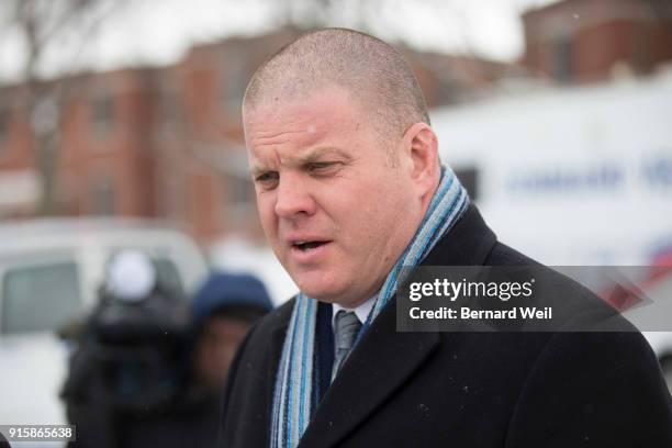 Officer Hank Idsinga speaks to the media where investigators removed evidence from inside the home at 53 Mallory Cresc., Toronto. Planters containing...