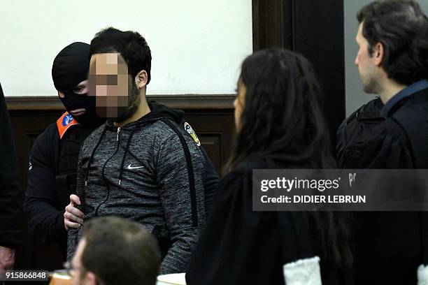 Alleged accomplice of the November 2015 Paris attacks suspect Salah Abdeslam, Sofiane Ayari, is escorted by Belgian police officers as he arrives in...